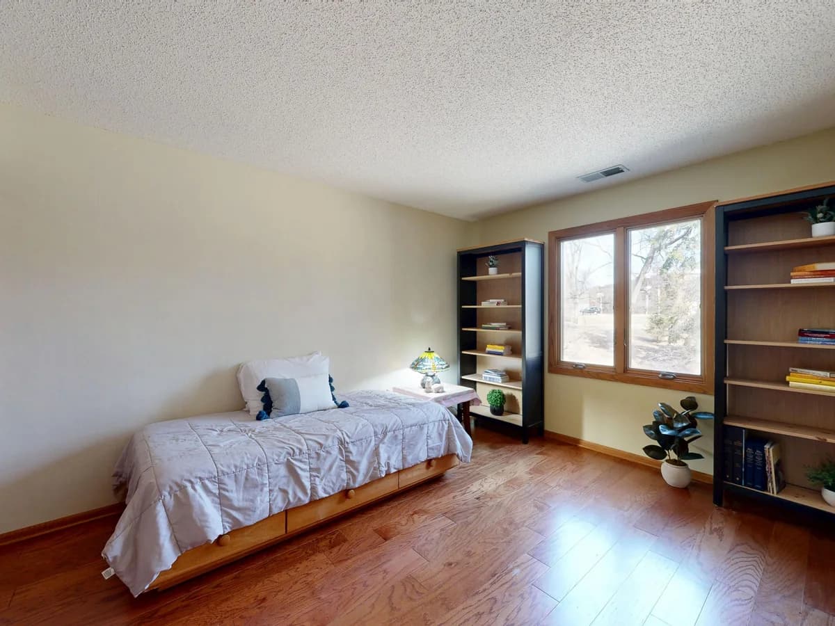 Placeholder graphic representing a cooled bedroom with a portable air conditioner near a window